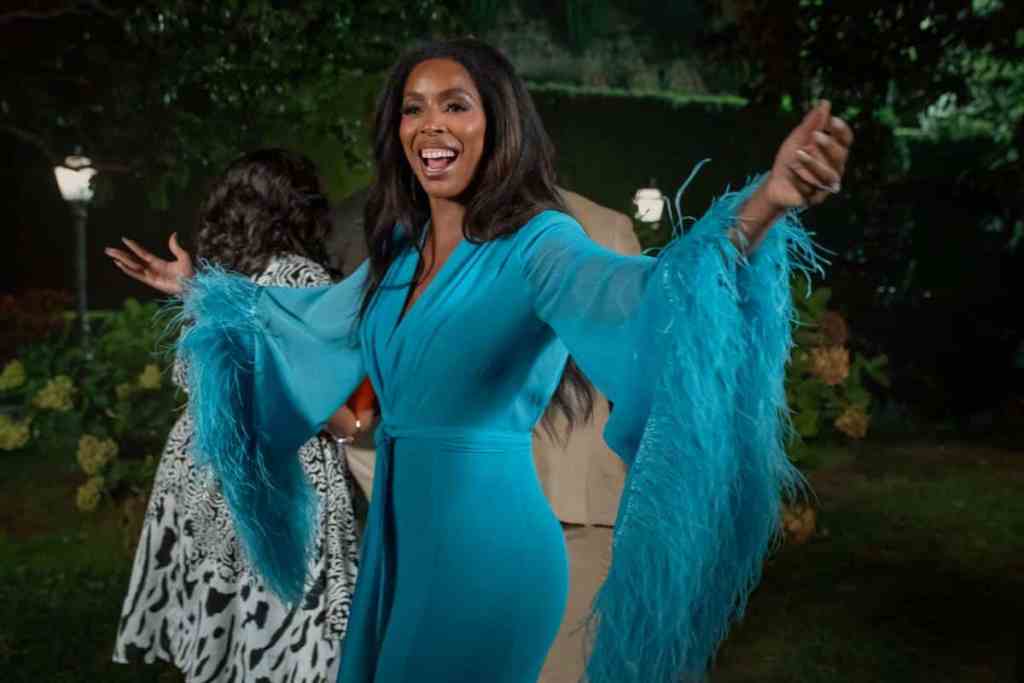 Netflix just dropped the first look at Tyler Perry's "Why Did I Get Married Again?" Woman in blue feathered dress.
